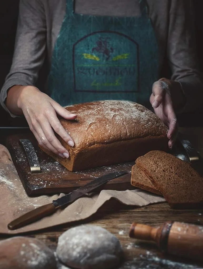 A baker holds Lithuanian bread